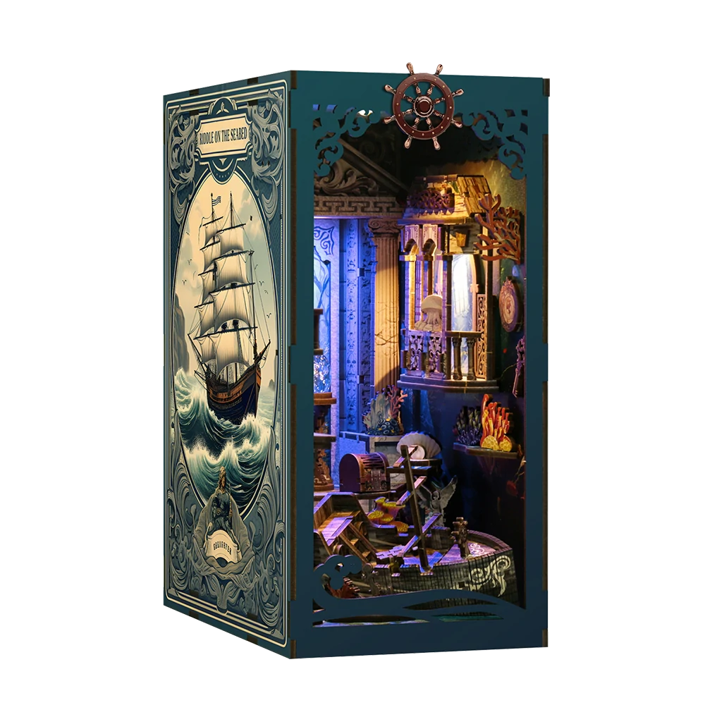 Vista del book nook Blue Ocean Legend terminado, con cubierta azul de temática marina, timón decorativo, luces cálidas, camarote náutico, corales y detalles de barco en miniatura.